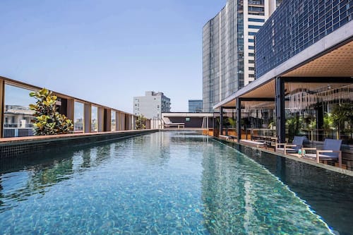 Outdoor pool, open 6:00 AM to 9:30 PM, sun loungers