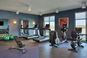 A gym with treadmills, elliptical machines, and exercise balls. - Four Points by Sheraton Fargo Medical Center (Fargo)
