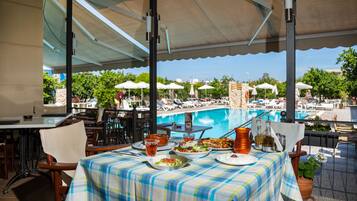 Breakfast, lunch, dinner served; pool views