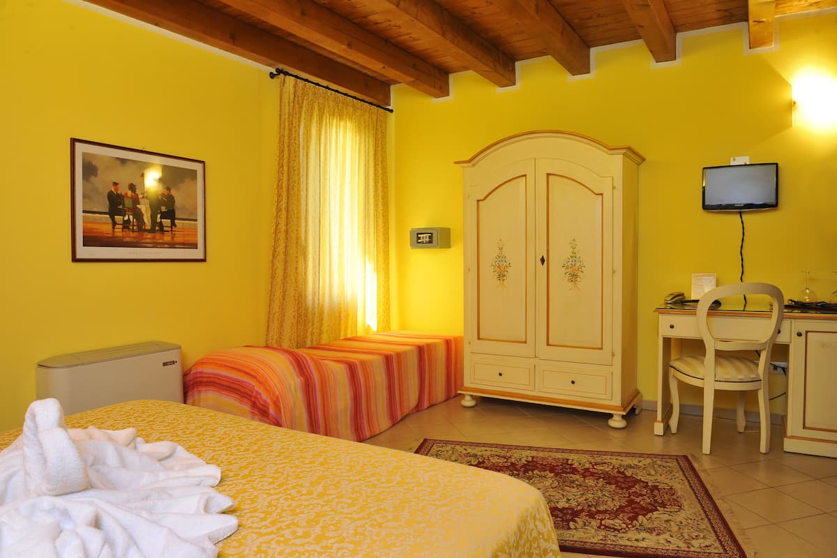 Triple Room (Matrimonial Bed plus Extra Bed)