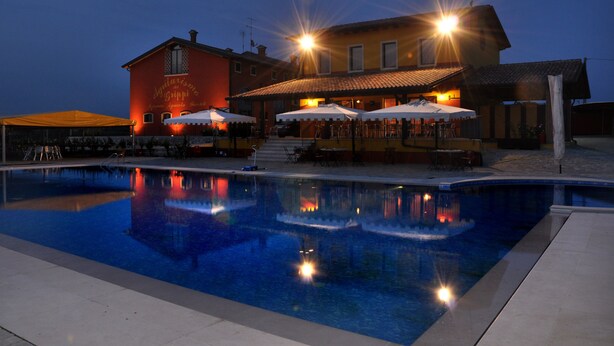 A swimming pool with a building in the background.