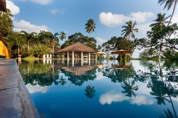Outdoor pool, pool umbrellas, sun loungers