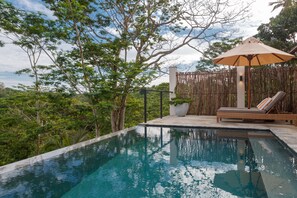 Outdoor pool, pool umbrellas, sun loungers