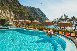 Outdoor pool, an infinity pool, pool loungers