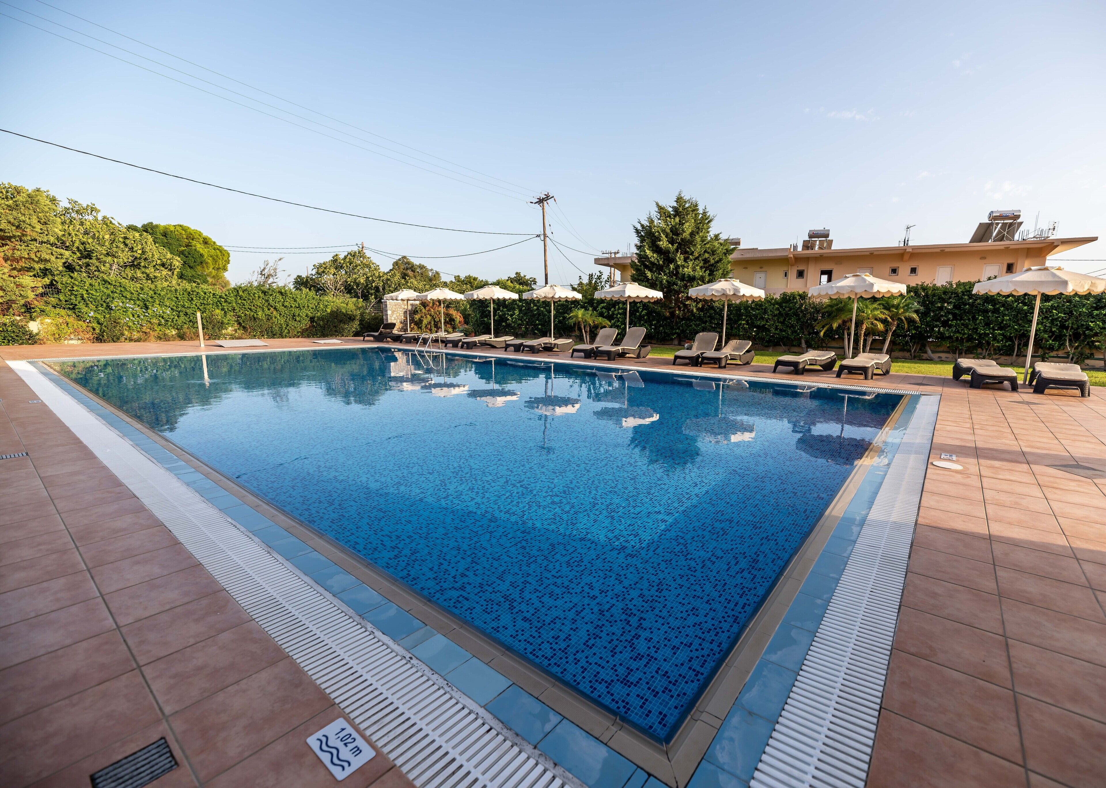 Seasonal outdoor pool, pool umbrellas, sun loungers