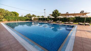 Seasonal outdoor pool, pool umbrellas, pool loungers