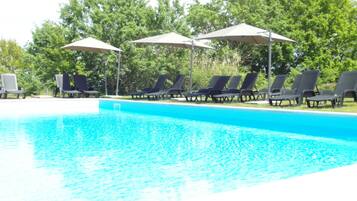 Seasonal outdoor pool, pool umbrellas, pool loungers