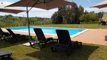 Seasonal outdoor pool, pool umbrellas, pool loungers