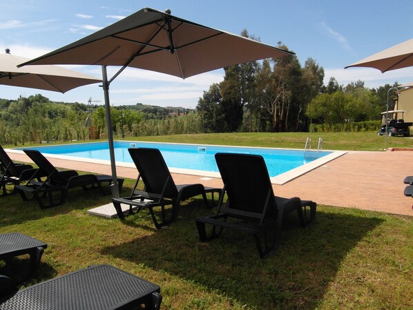 Seasonal outdoor pool, pool umbrellas, sun loungers