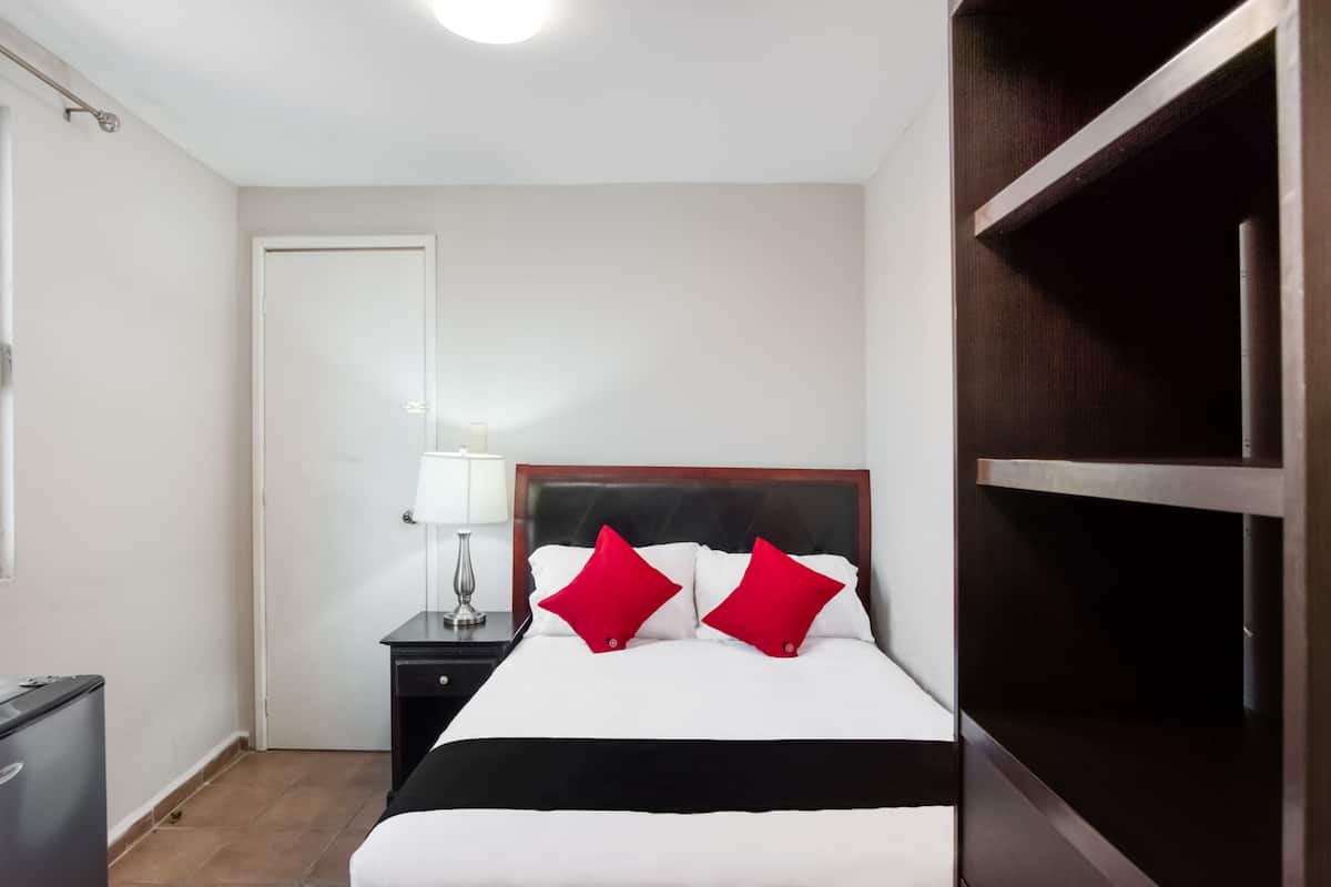 Economy Room | Down comforters, minibar, in-room safe, iron/ironing board
