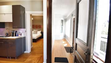 Deluxe Suite, 1 Queen Bed, Patio | Living area | Flat-screen TV