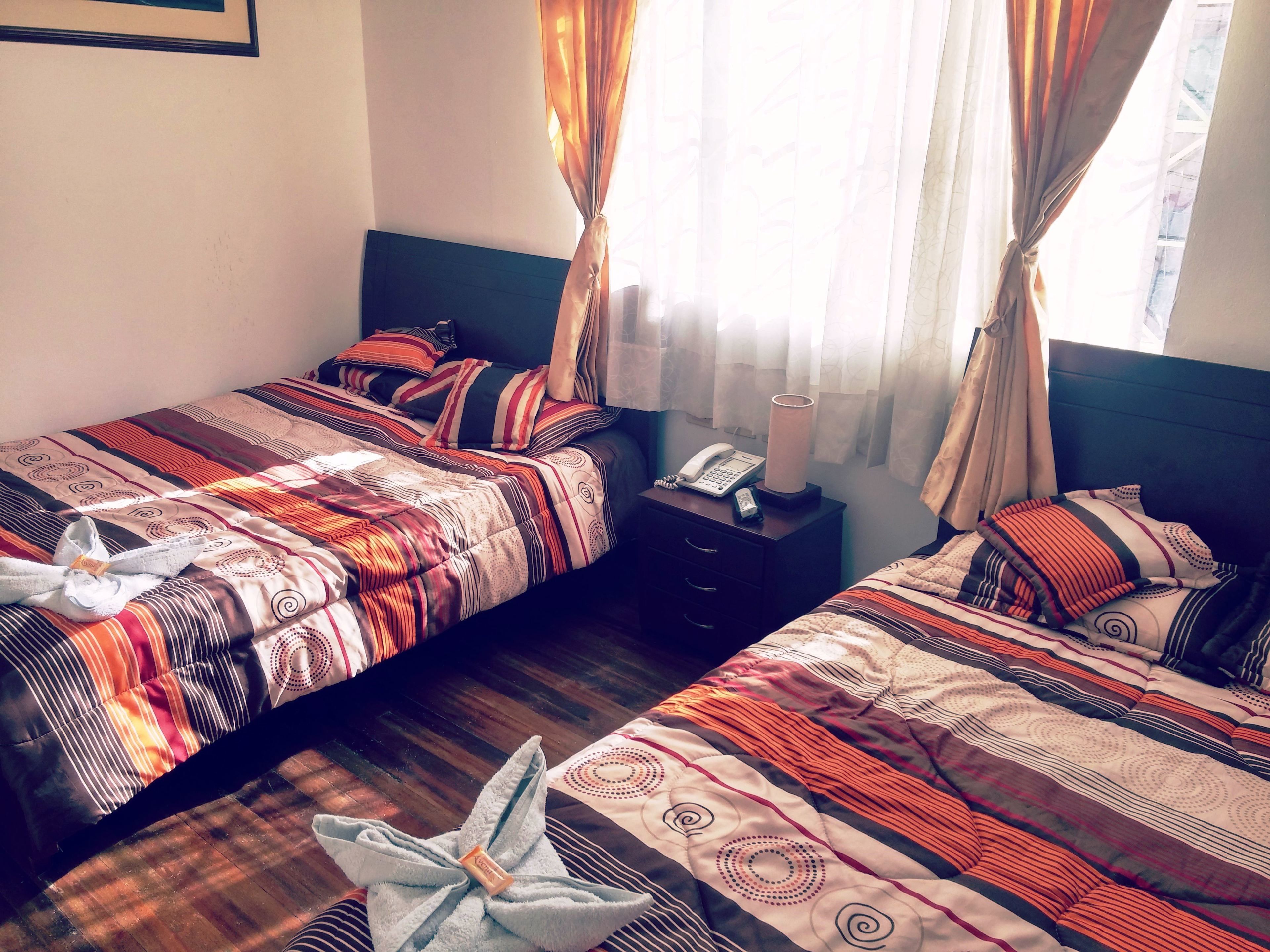 double room, 2 double beds, shared bathroom | down duvets, individually decorated, individually furnished