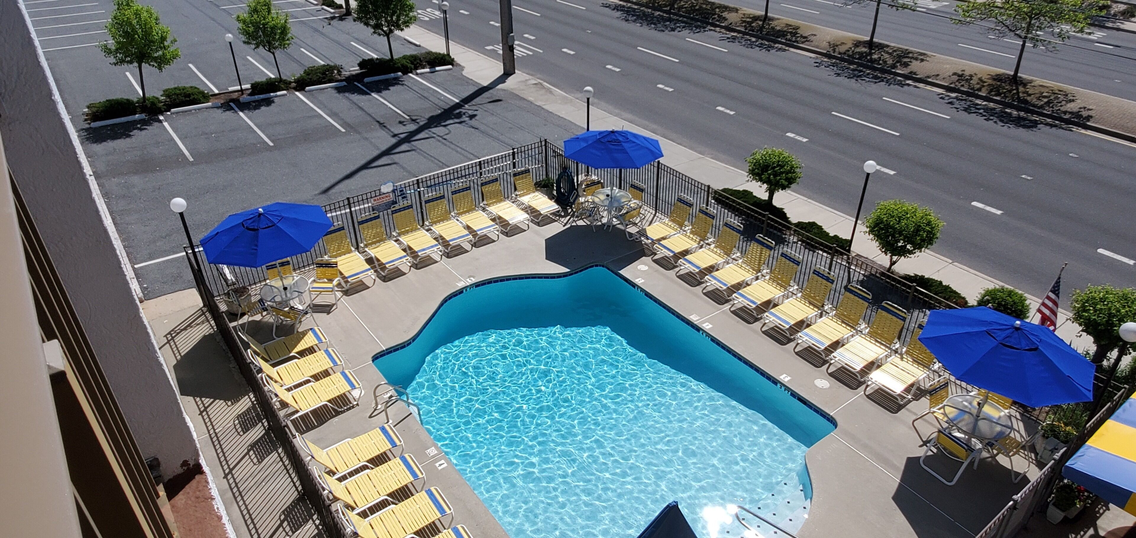 seasonal outdoor pool, pool umbrellas, pool loungers
