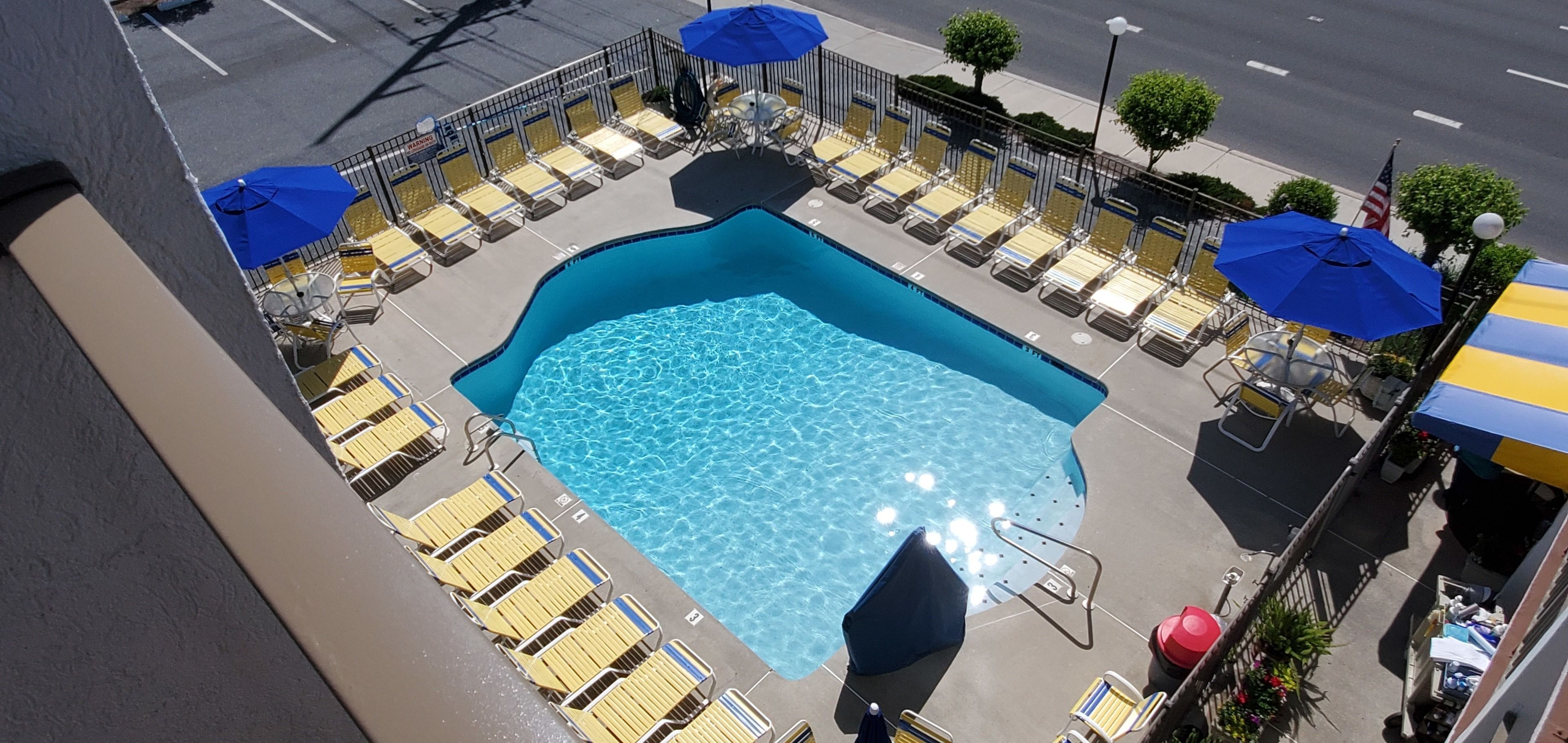 seasonal outdoor pool, pool umbrellas, pool loungers