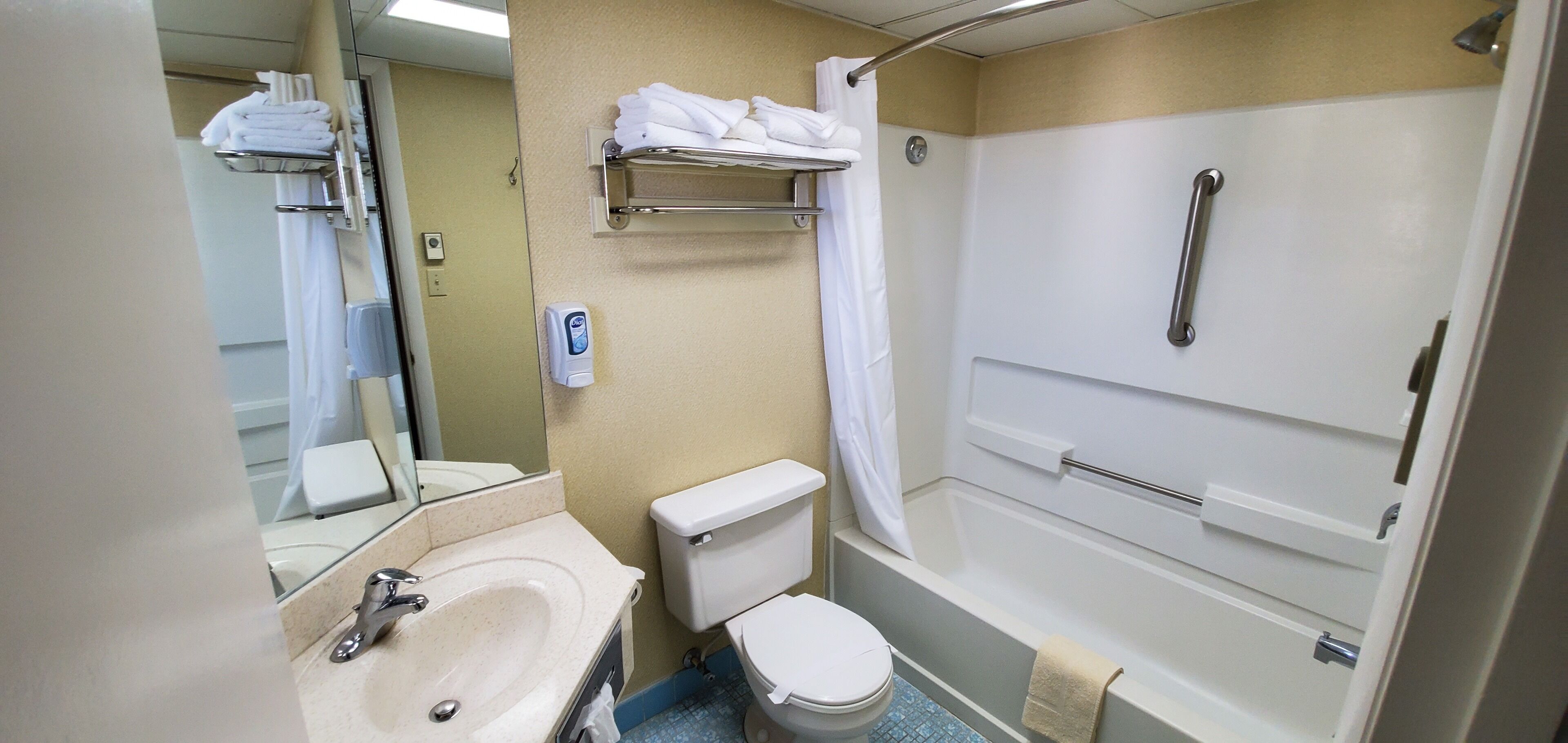 combined shower/bathtub, hair dryer, towels, soap