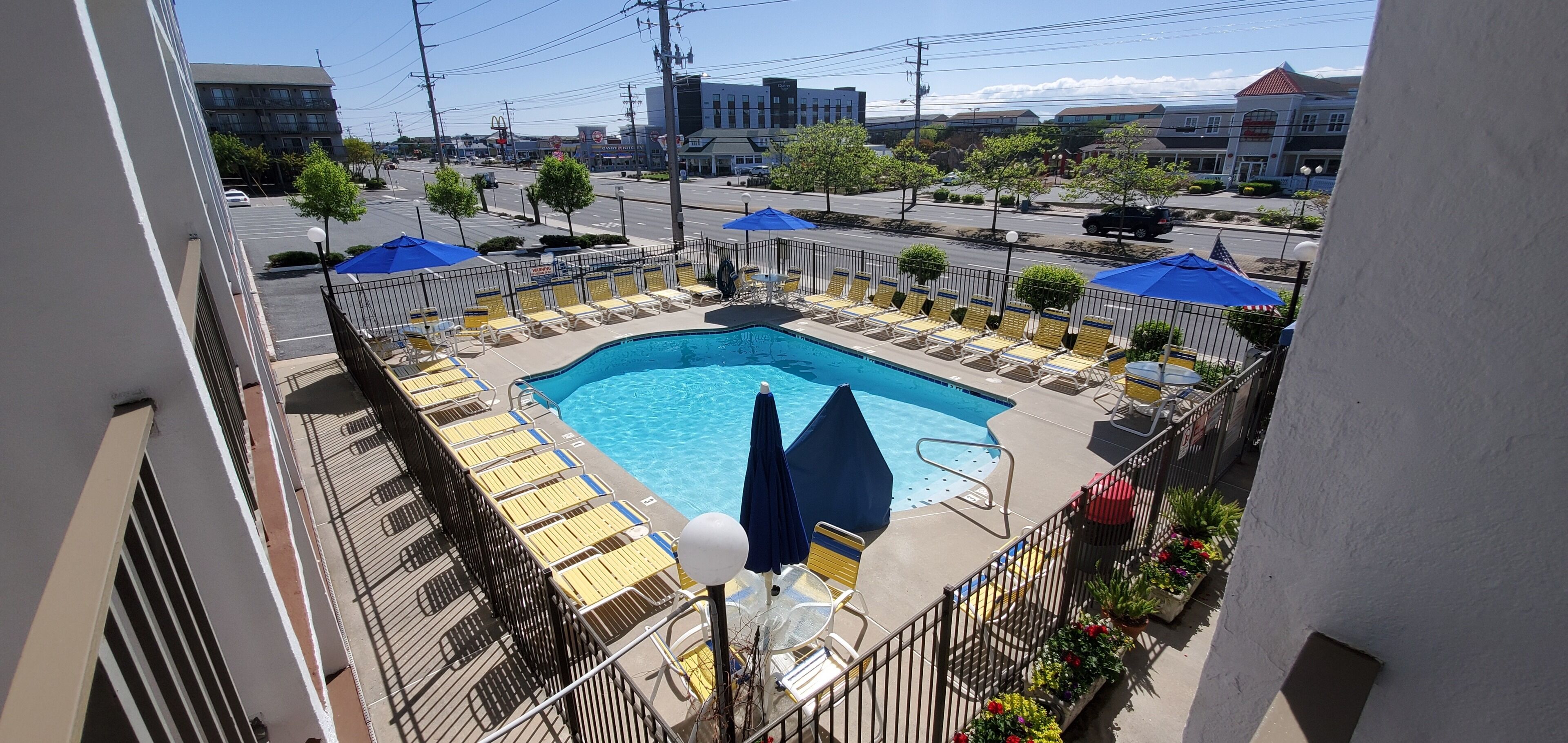 seasonal outdoor pool, pool umbrellas, pool loungers