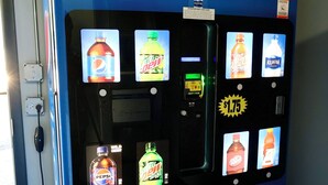 A Pepsi vending machine with multiple beverage options, including Mountain Dew, Wild Cherry, and Aquafina. - Hillsboro Inn & Suites (Hillsboro)