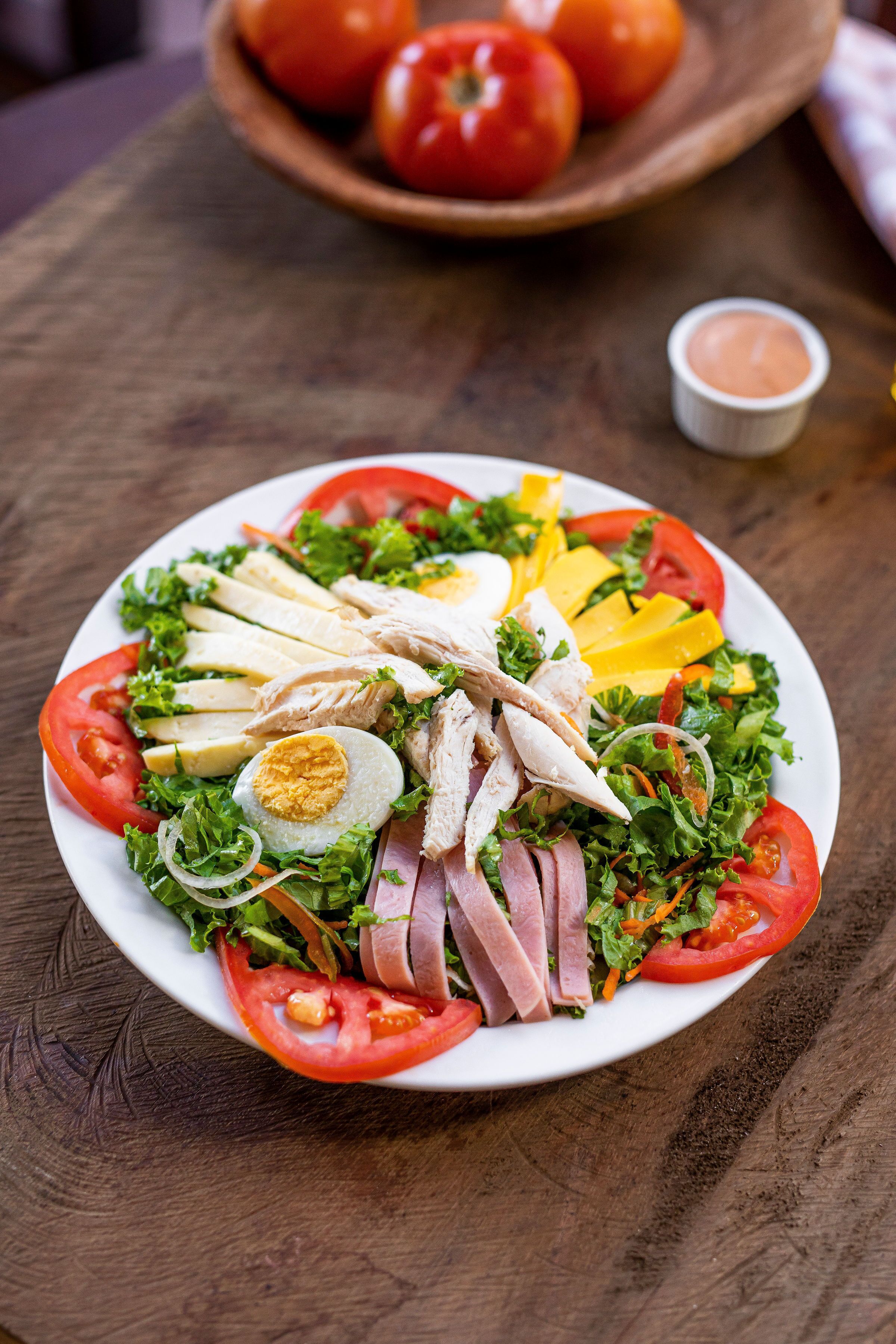 A plate of salad with various ingredients.