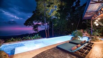 Outdoor pool, an infinity pool, free cabanas, sun loungers