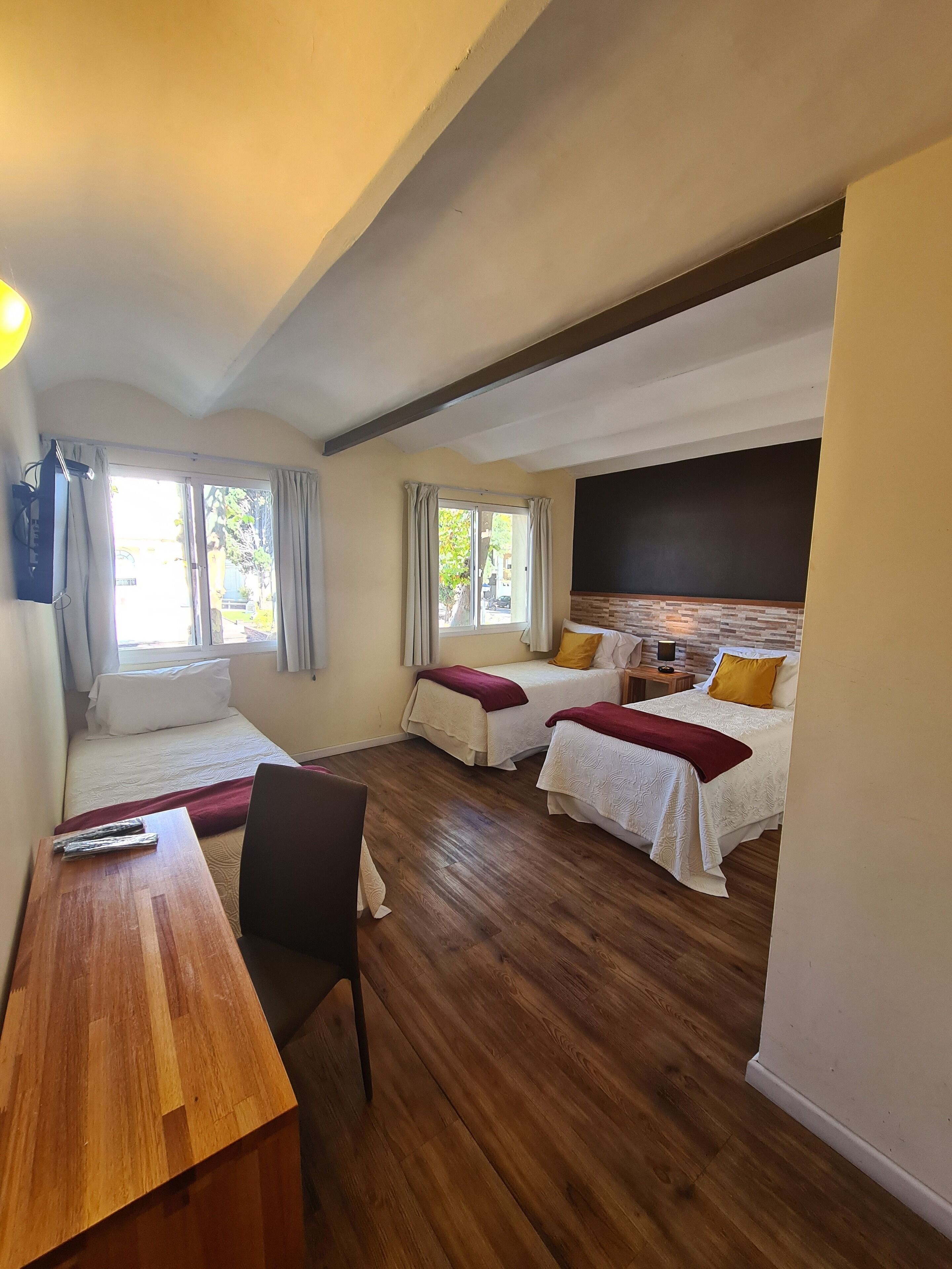 Superior Triple Room | Minibar, in-room safe, desk, blackout curtains