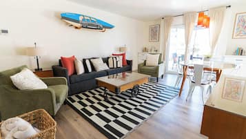 Deluxe Villa, 2 Queen Beds | Living area | 42-inch flat-screen TV with cable channels, TV
