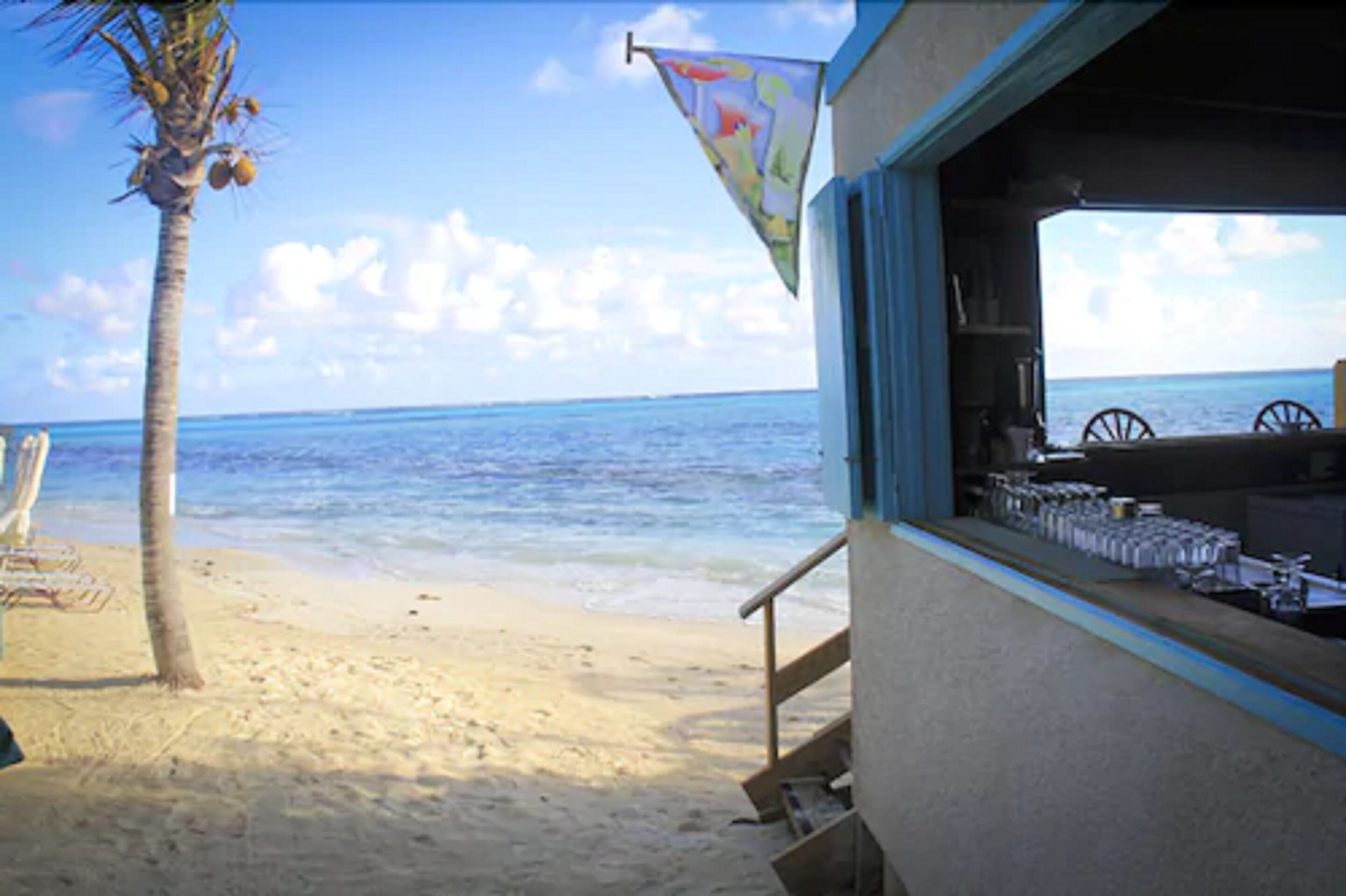 on the beach, sun-loungers, beach umbrellas, beach towels