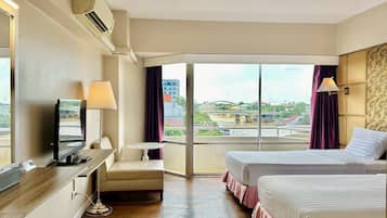 Deluxe King or Twin with River View | 1 bedroom, in-room safe, desk, rollaway beds