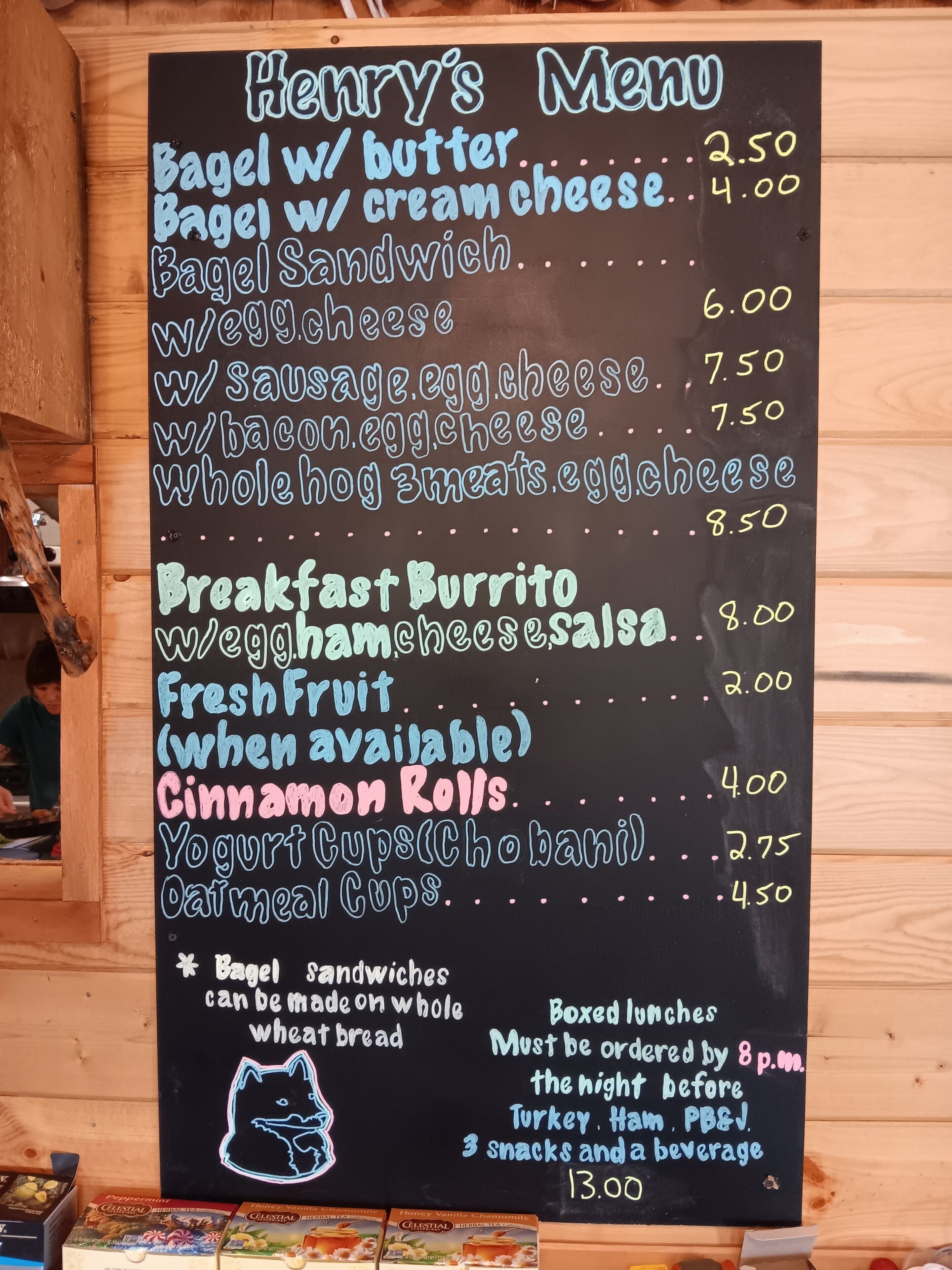 A blackboard menu with various breakfast items and prices.