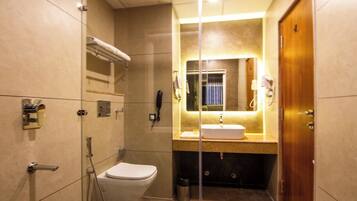 Zojila Premium Room | Bathroom | Shower, free toiletries, hair dryer, slippers
