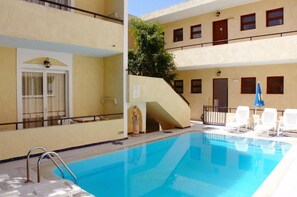 Seasonal outdoor pool, pool umbrellas, pool loungers