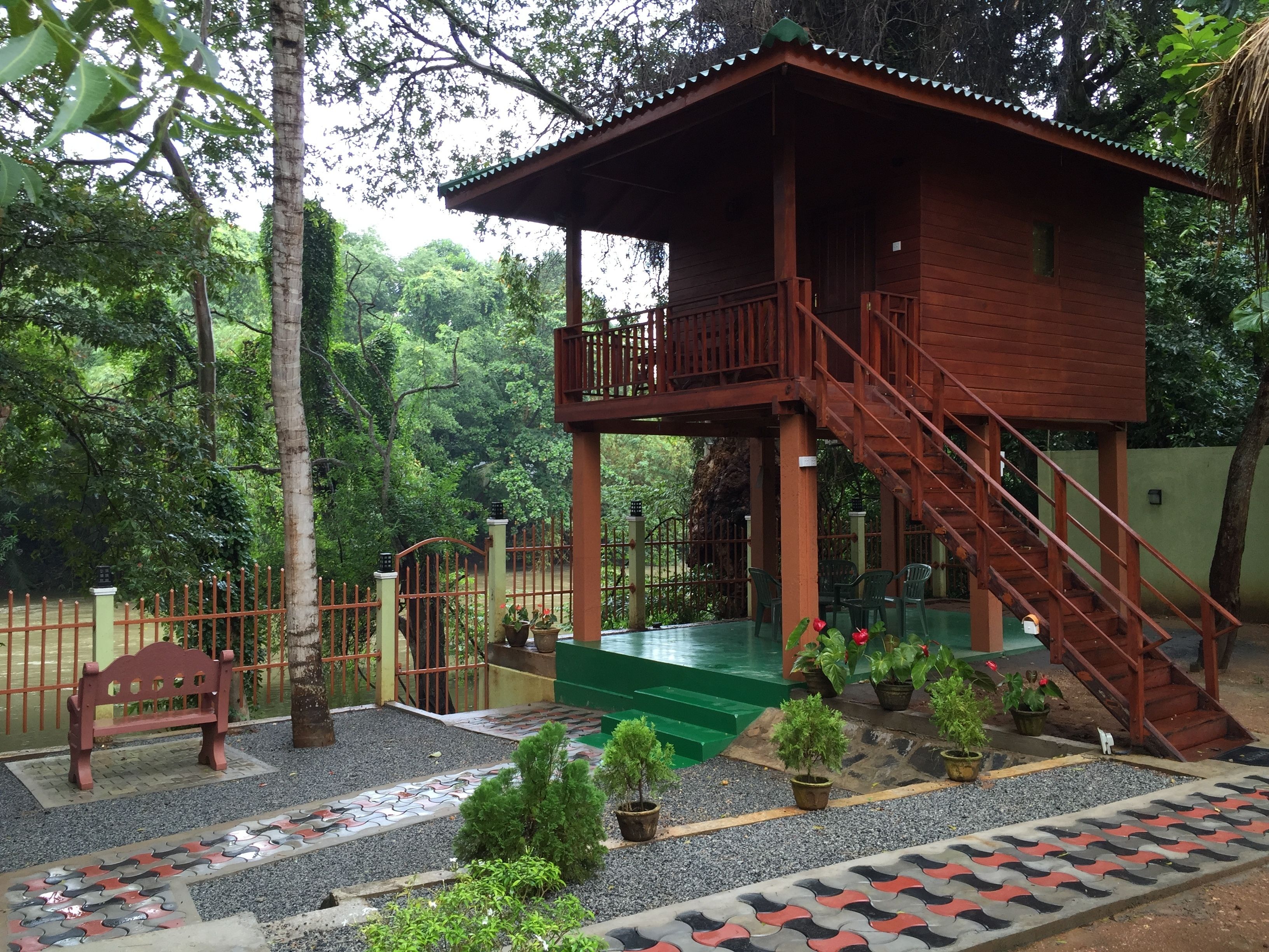 deluxe tree house, 1 king bed, river view | garden view