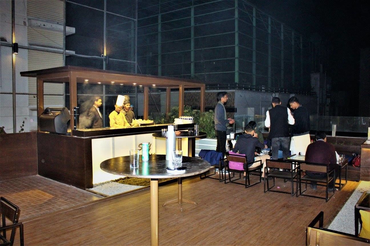 An outdoor dining area with a counter and seating.