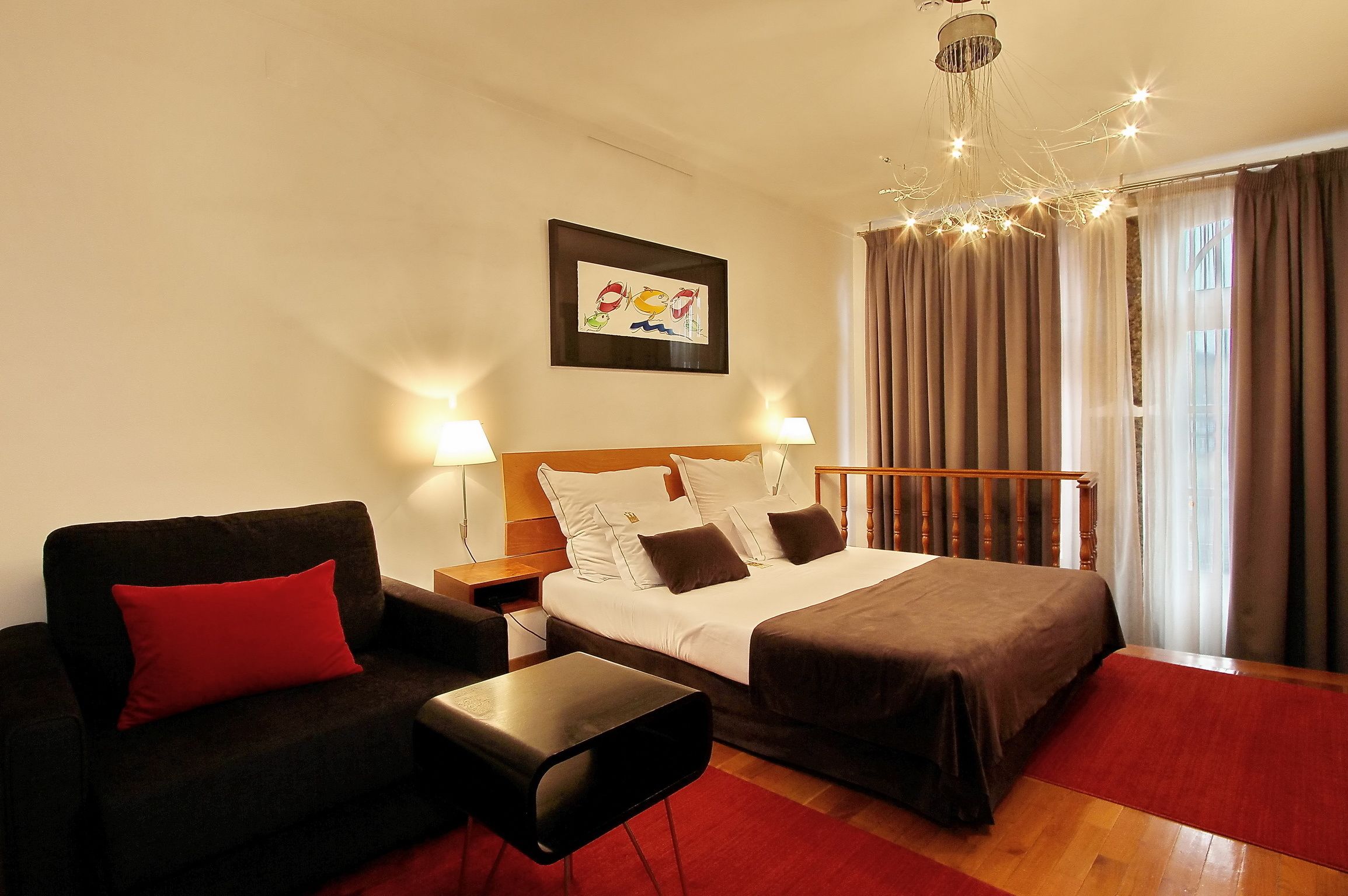 deluxe double or twin room | in-room safe, individually decorated, desk, blackout curtains