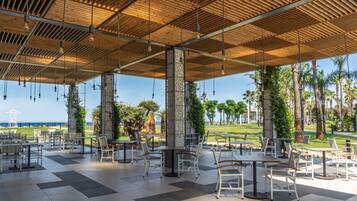 3 bars/lounges, poolside bar, beach bar