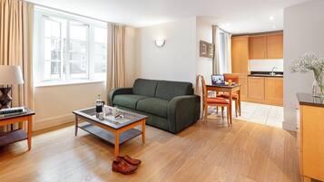 Desk, iron/ironing board, bed sheets