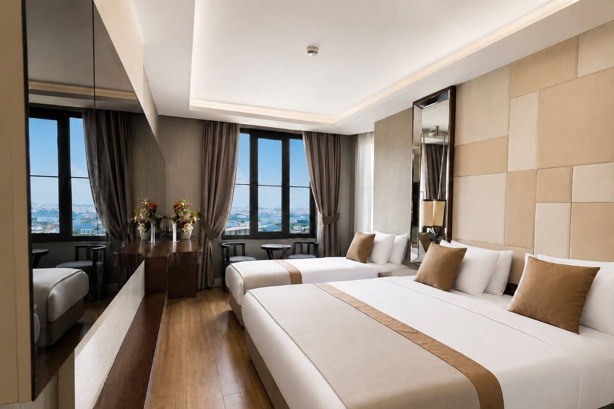 Deluxe Triple Room, Sea View | Premium bedding, minibar, in-room safe, desk
