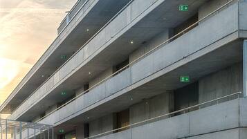 A multi-level parking structure with concrete floors and railings.
