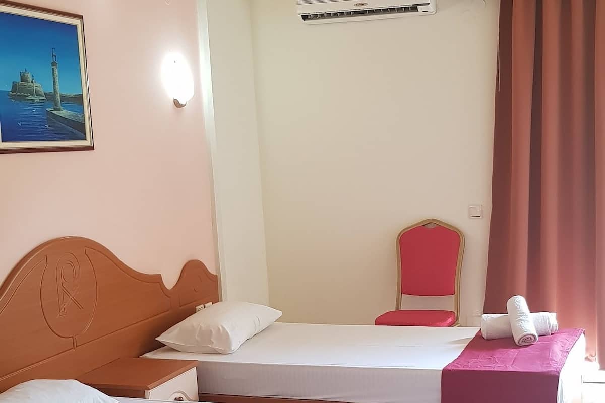 Standard Room, Garden View | Blackout drapes, cribs (free), WiFi (free)