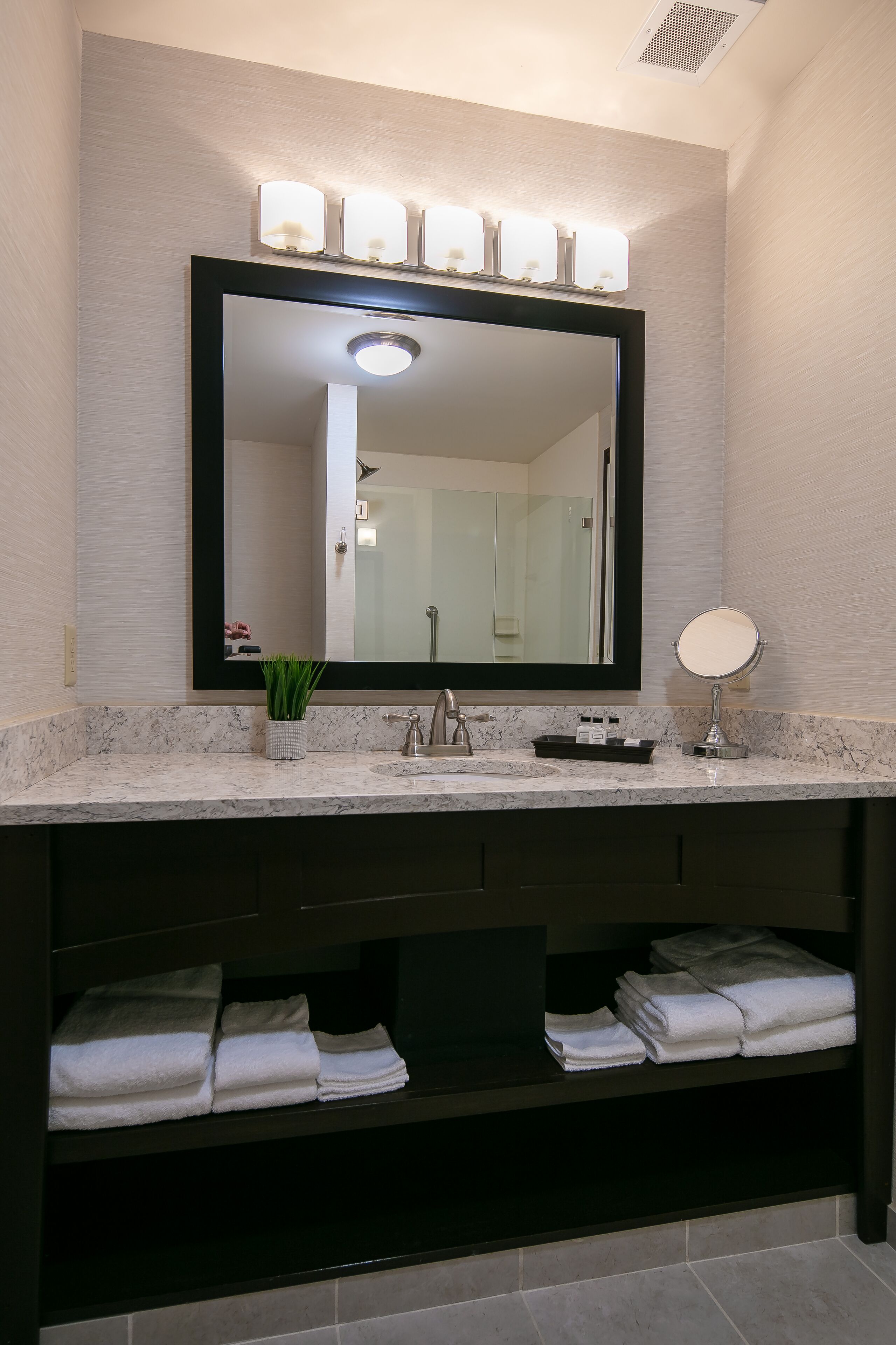 rainfall showerhead, designer toiletries, hair dryer, towels