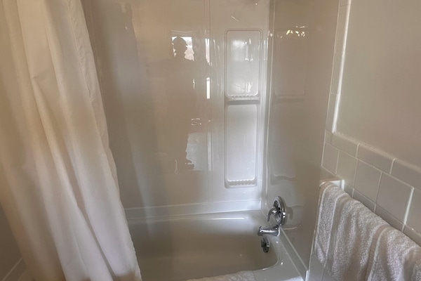 Standard Room, 2 Queen Beds | Bathroom | Combined shower/tub, free toiletries, hair dryer, towels