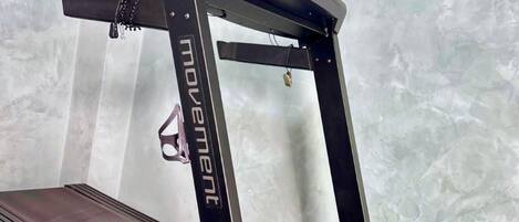 A treadmill with the brand name 'movement' visible on the frame.