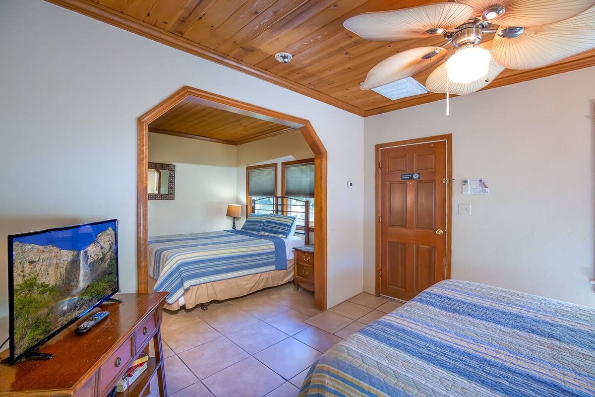 Traditional Suite, 2 Queen Beds | Cribs (free), WiFi (free), bed sheets