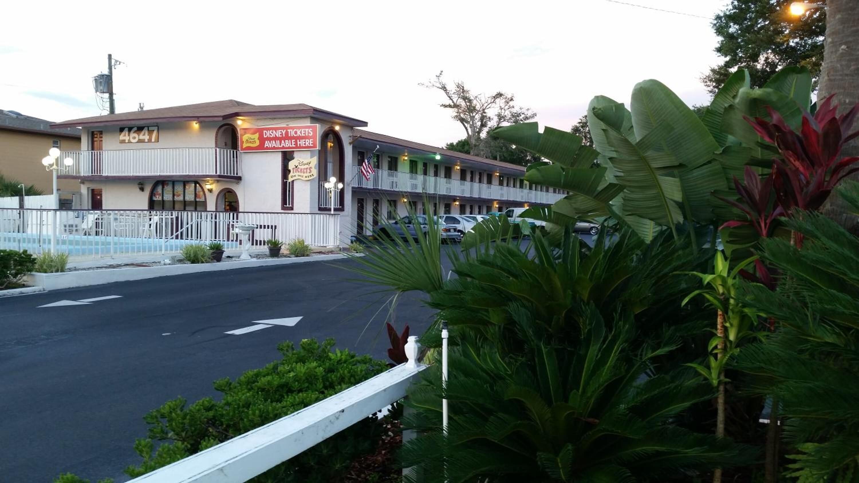 A building with a sign indicating Disney tickets available.
