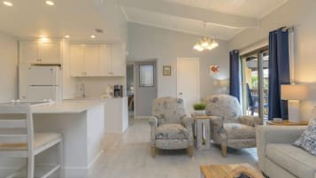 Superior Condo, Multiple Beds, Balcony, Pool View | Living area | 24-inch TV with cable channels