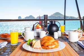 Enjoy a scenic ocean view while savoring a delicious breakfast on the boat.