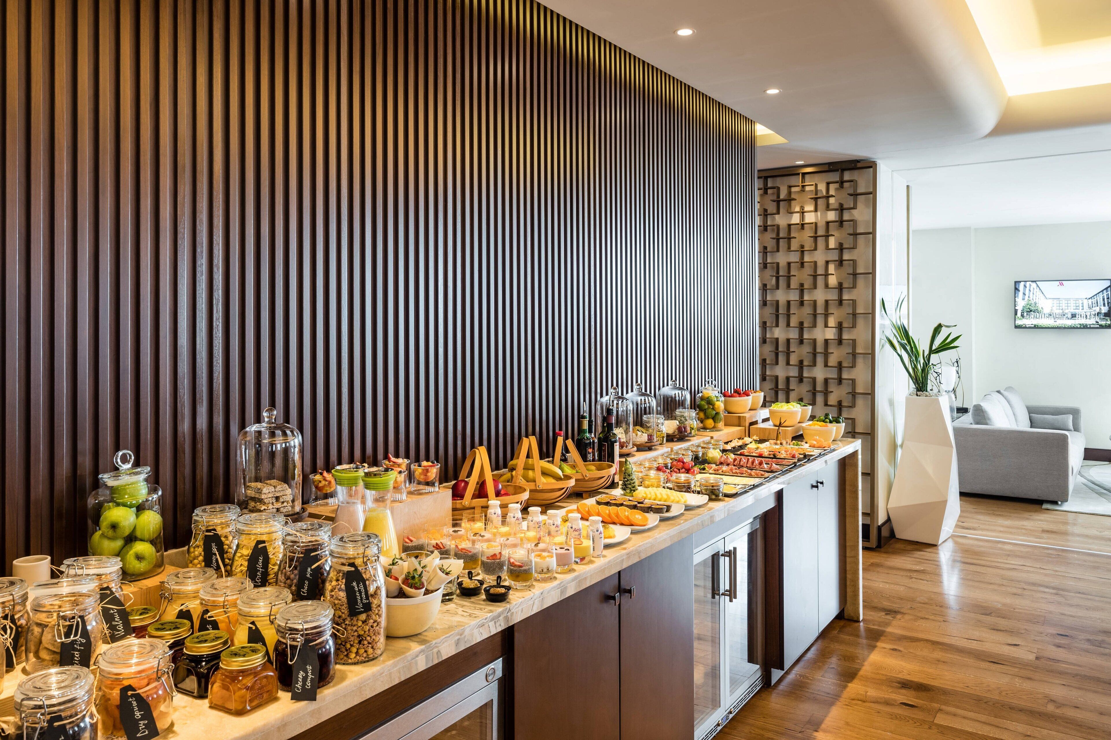 A breakfast buffet with various food items and condiments.