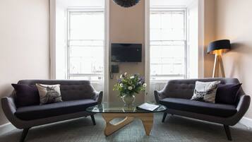 Superior Apartment | Living area | 32-inch flat-screen TV with digital channels, TV, iPod dock