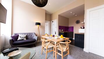 Apartment, 1 Bedroom, Kitchen | Living area | 32-inch flat-screen TV with digital channels, TV, iPod dock