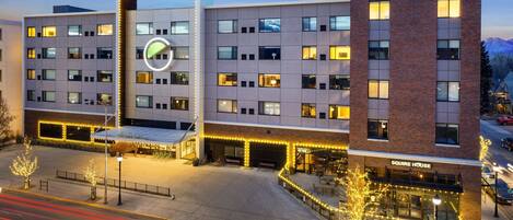 A multi-story hotel with a prominent 'element by Westin' sign, a 'SQUIRE HOUSE' section, and a well-lit entrance area with outdoor seating.