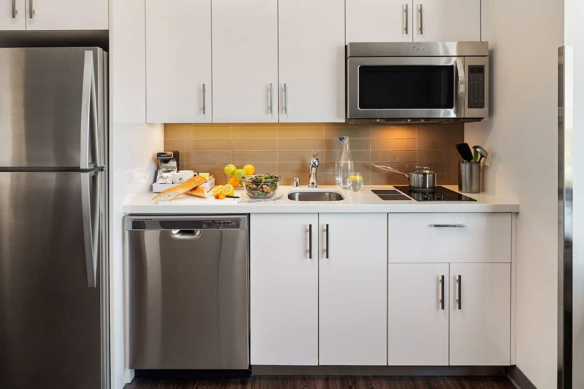 full-sized fridge, microwave, stovetop, dishwasher